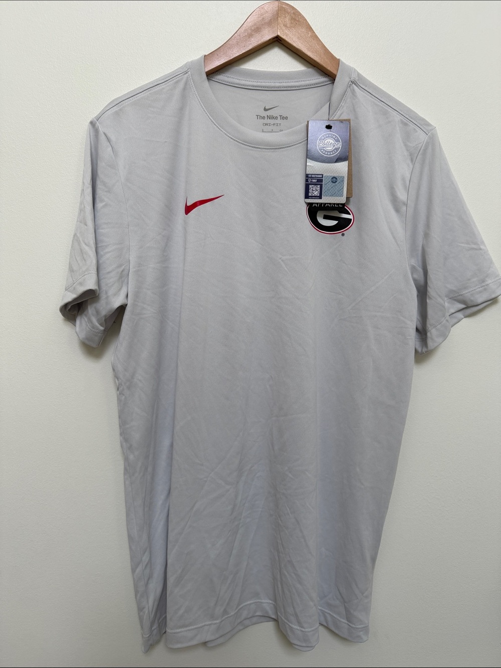 Nike Men’s Light Gray Short Sleeve Tee with Red Swoosh and Team Patch